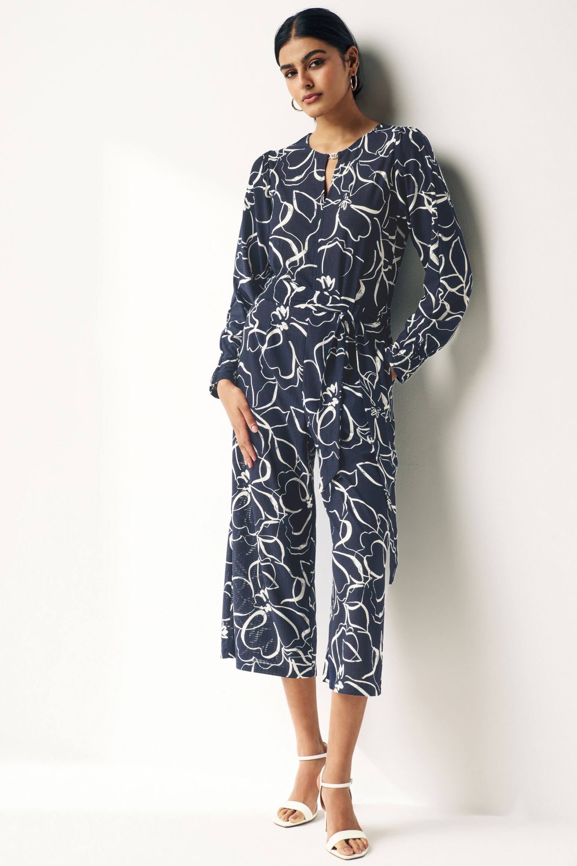 Navy Blue Swirl Print Long Sleeve Belted Jumpsuit - Image 1 of 8