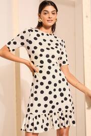 Friends Like These Black/White Print Short Sleeve Ruffle Hem Jersey Mini Dress - Image 1 of 4