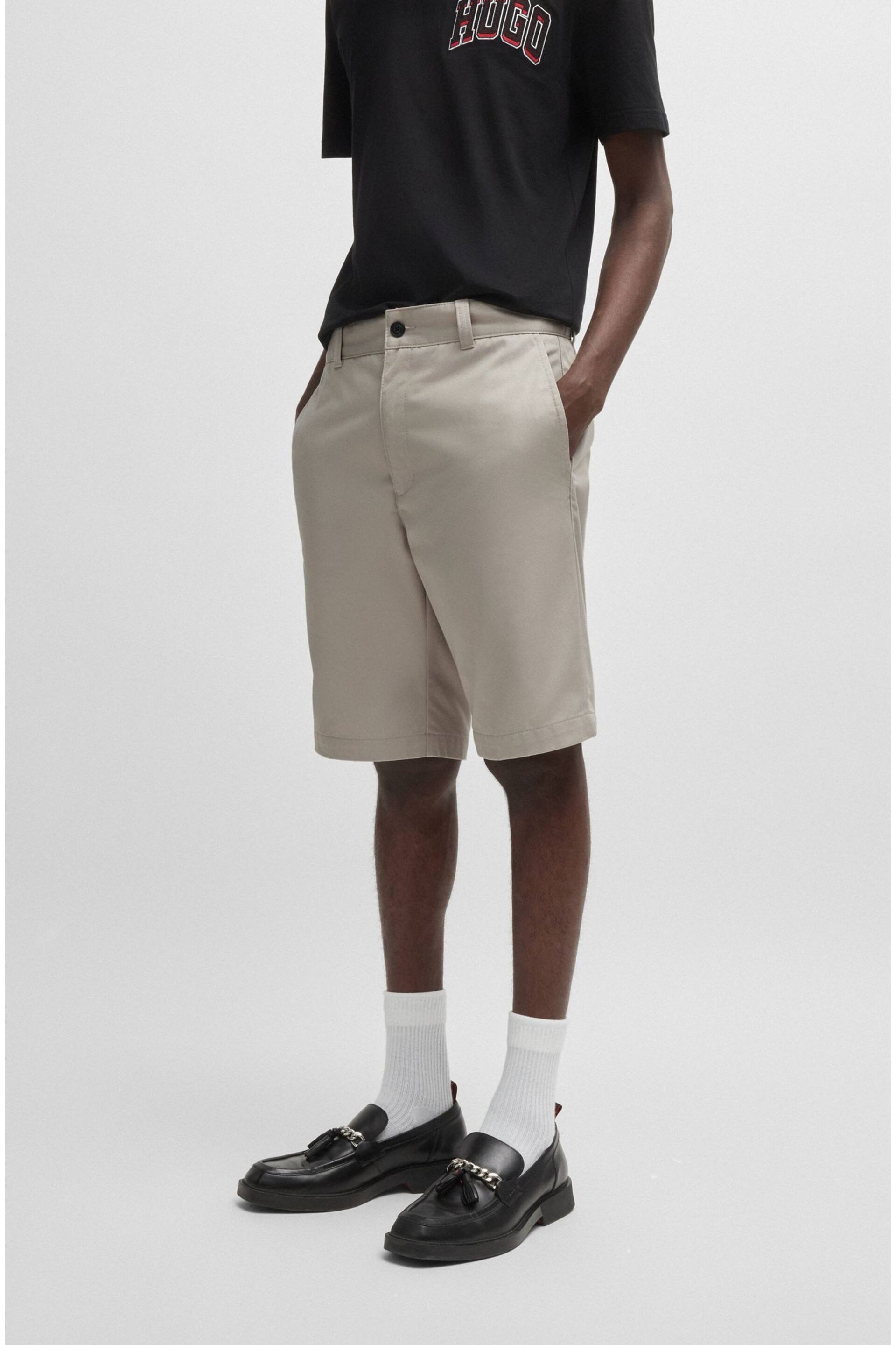 HUGO Regular-fit shorts with slim leg and buttoned pockets - Image 1 of 5