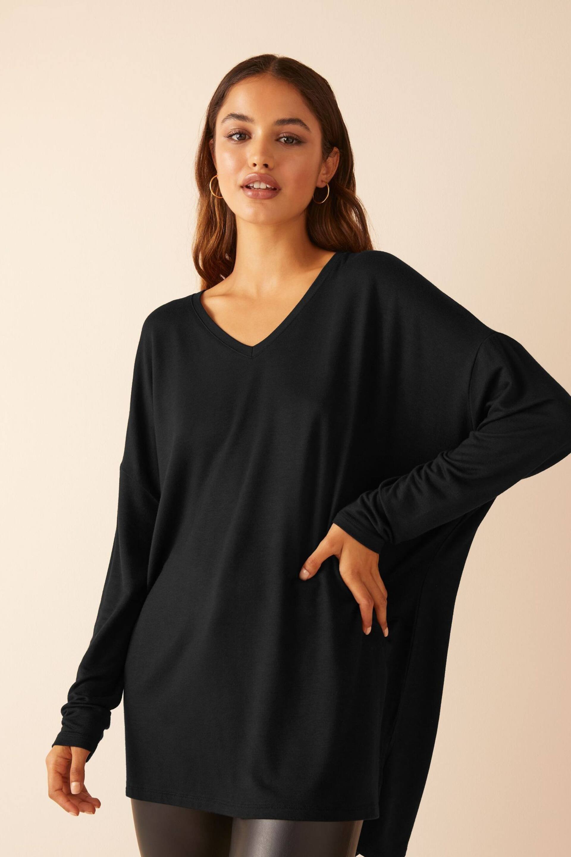 Friends Like These Black Petite Short Sleeve V Neck Tunic Top - Image 1 of 4