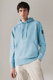 Calvin Klein Blue Woven Badge Hoodie - Image 1 of 4