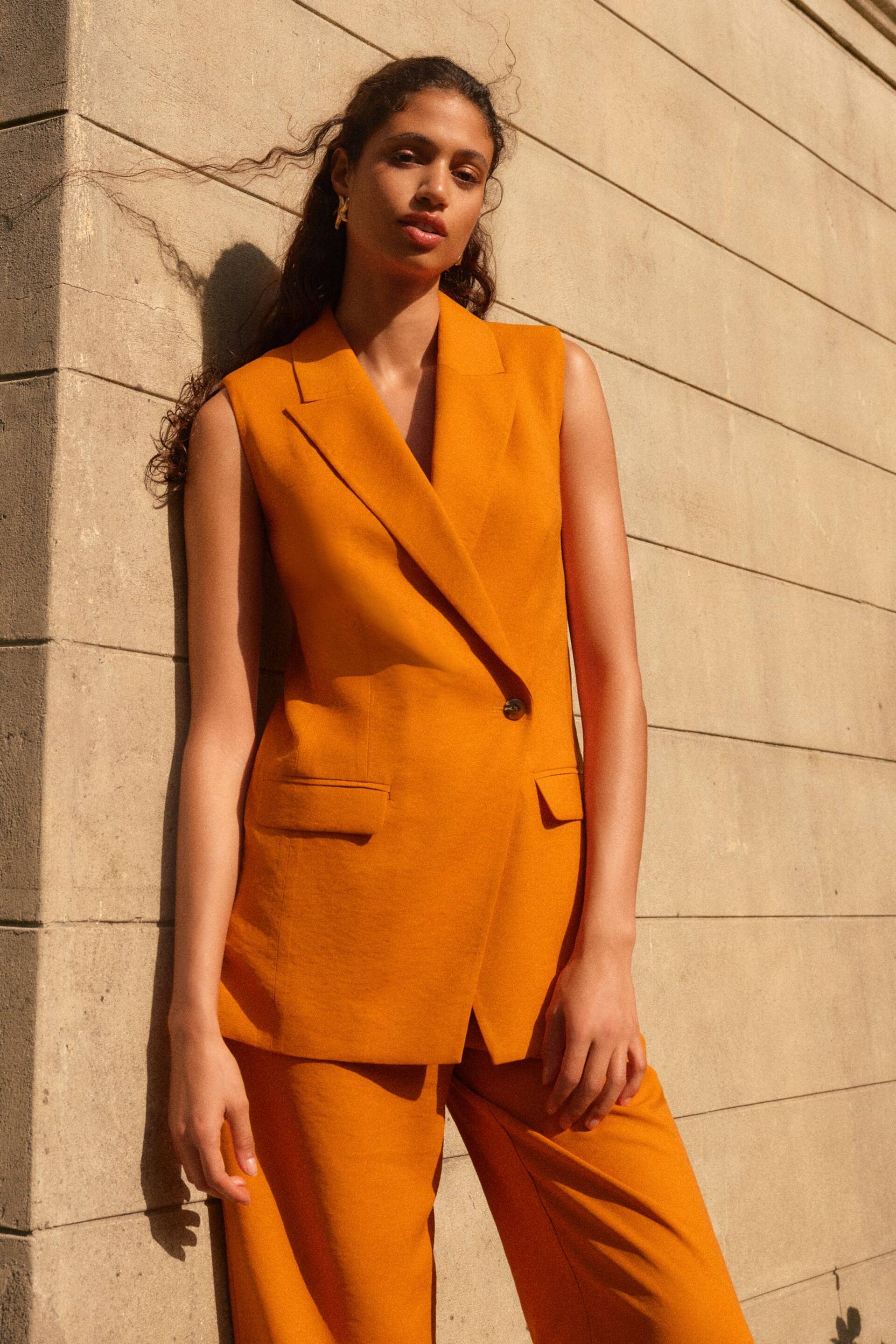 Orange Sleeveless Asymmetric Tailored Blazer - Image 1 of 6