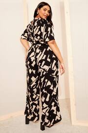 Curves Like These Black/White Flutter Sleeve Wide Leg Jumpsuit - Image 4 of 4