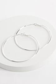 Silver Tone Oversized Hoop Earrings - Image 1 of 2