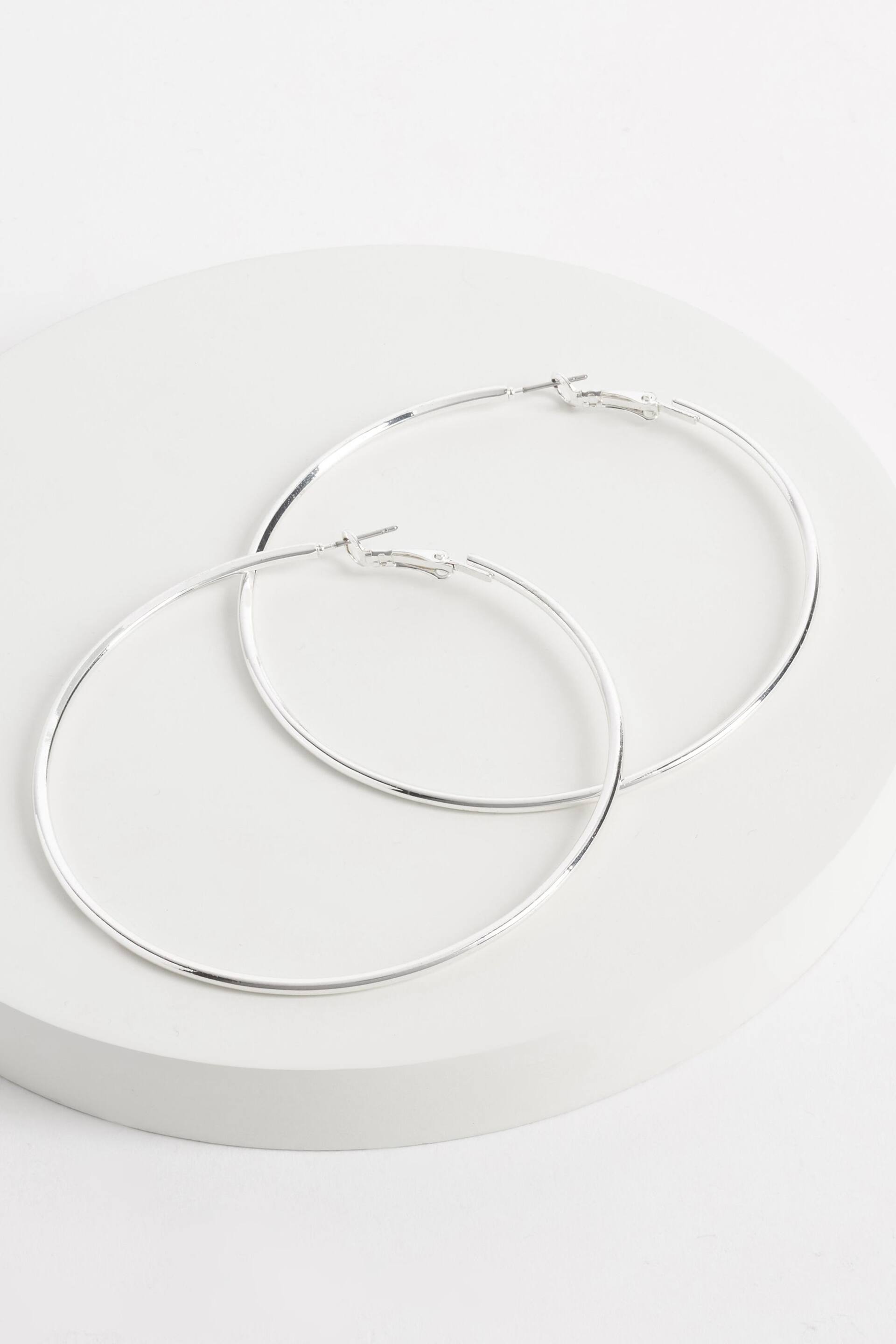 Silver Tone Oversized Hoop Earrings - Image 1 of 2